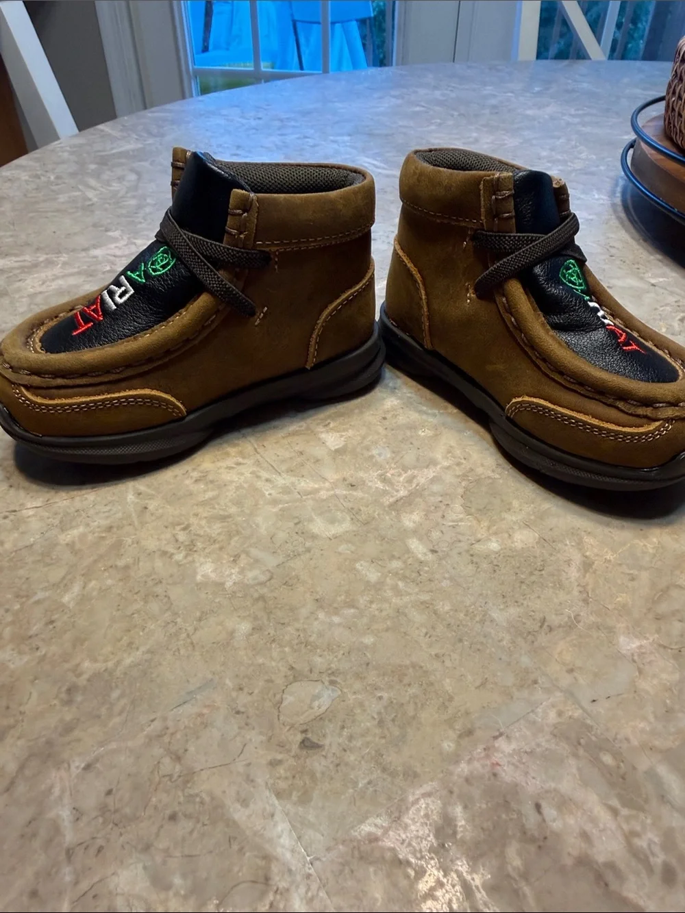Ariat Kids Suede Moccasins in Brown with Black Inlay